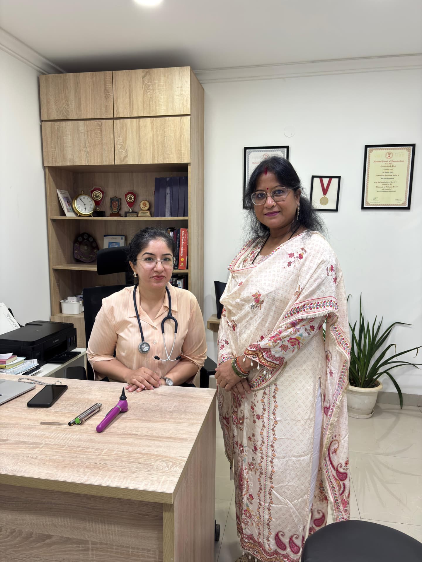 Dr. Aashima Chopra with a patient at the clinic