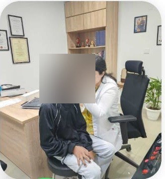 Dr. Aashima Chopra examining a young patient's ear at ENT Care Clinic